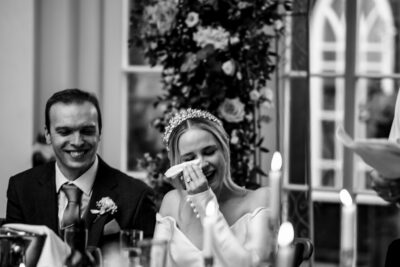 Tears of joy and laughter, wedding speech photo. Alberta wedding photographer